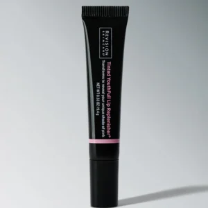 Revision Skincare YouthFull Lip Replenisher in Tinted Rose at Entice Dallas, providing deep hydration and lip volume.